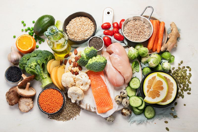 ilustrasi makanan sehat Healthy food selection on white background. Detox and clean diet concept. Foods high in vitamins, minerals and antioxidants. Anti age foods. Top view.