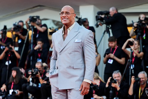 Cast member Dwayne Johnson poses on the red carpet during arrivals for the screening 