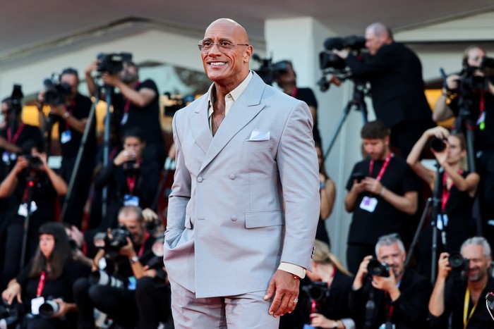 Cast member Dwayne Johnson poses on the red carpet during arrivals for the screening 
