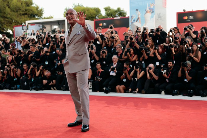 Cast member Dwayne Johnson poses on the red carpet during arrivals for the screening 