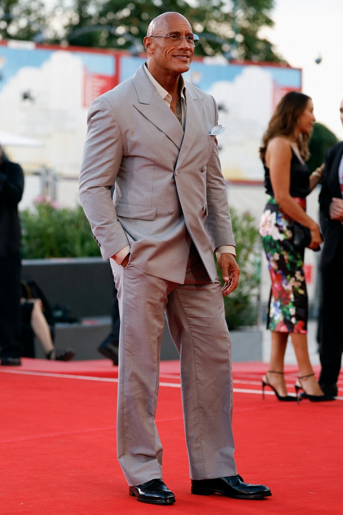 Cast member Dwayne Johnson poses on the red carpet during arrivals for the screening 