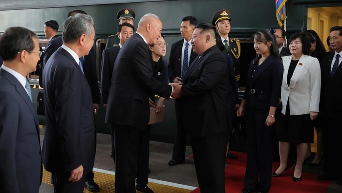 This photo provided by the North Korean government, North Korean leader Kim Jong Un, center right, is greeted by China’s Senior Politburo Standing Committee member Cai Qi, center left, on his arrival at a station in Beijing, China, Tuesday, Sept. 2, 2025. Independent journalists were not given access to cover the event depicted in this image distributed by the North Korean government. The content of this image is as provided and cannot be independently verified. (Korean Central News Agency/Korea News Service via AP)