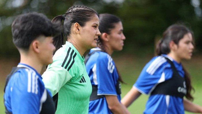 Soccer Football - Members of the Afghan Women's Refugee team pose for a team group during a selection camp at St. George's Park, Burton upon Trent, Britain - August 26, 2025 REUTERS/John Sibley