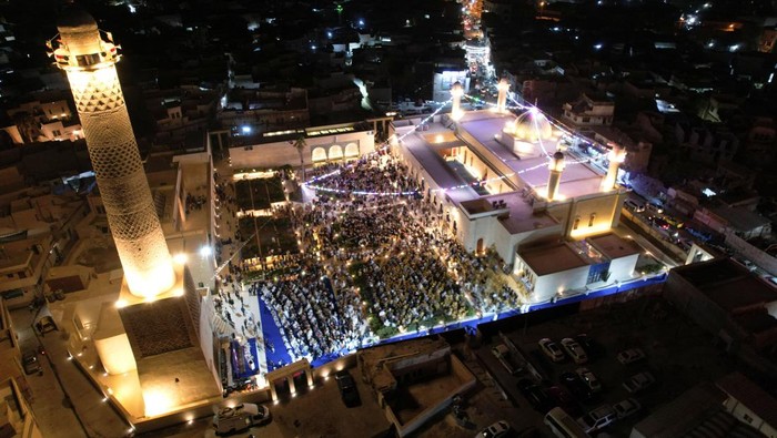 A drone view shows people gathering at the Great Mosque of al-Nuri during a ceremony to mark the birth anniversary of Prophet Mohammad, in Mosul, Iraq, September 3, 2025. REUTERS/Khalid al-Mousily