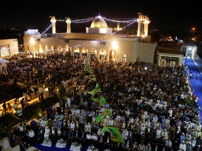 A drone view shows people gathering at the Great Mosque of al-Nuri during a ceremony to mark the birth anniversary of Prophet Mohammad, in Mosul, Iraq, September 3, 2025. REUTERS/Khalid al-Mousily