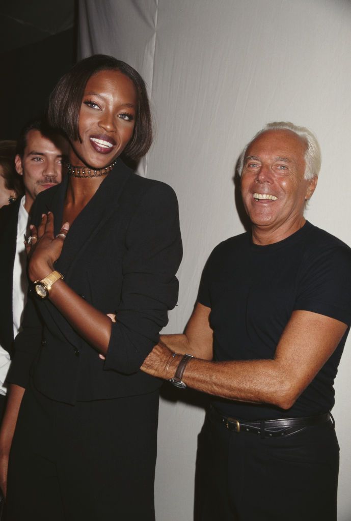 Italian fashion designer Giorgio Armani and English model Naomi Campbell attend a private party, 1996. (Photo by Rose Hartman/Archive Photos/Getty Images)