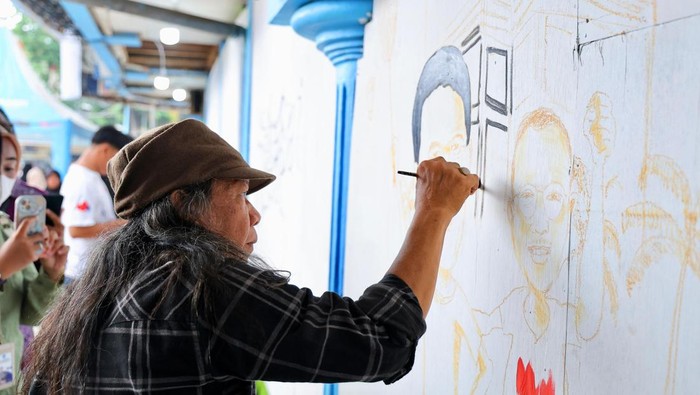 Lomba mural di Palembang.
