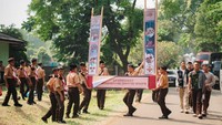 Terlihat para Pramuka bergotong royong mendirikan tenda dan gapura. Foto: (Panitia World Muslim Scout Jamboree (WMSJ) 2025 )