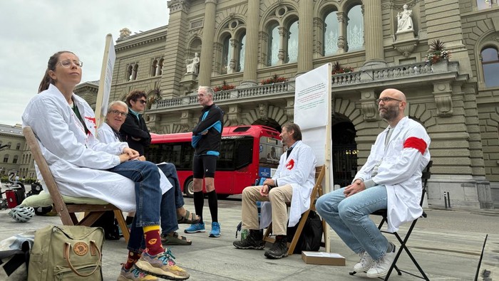 Doctors Michele Ghielmini, Brenno Balestra, Alessandra Guaita and Marco Franzi sit outside the Swiss Parliament building (Bundeshaus) at the start of their hunger strike over Gaza, calling on their government to apply targeted sanctions on Israel over its alleged violations of international law and to recognise a Palestinian state, in Bern, Switzerland, September 8, 2025.  REUTERS/Cecile Mantovani