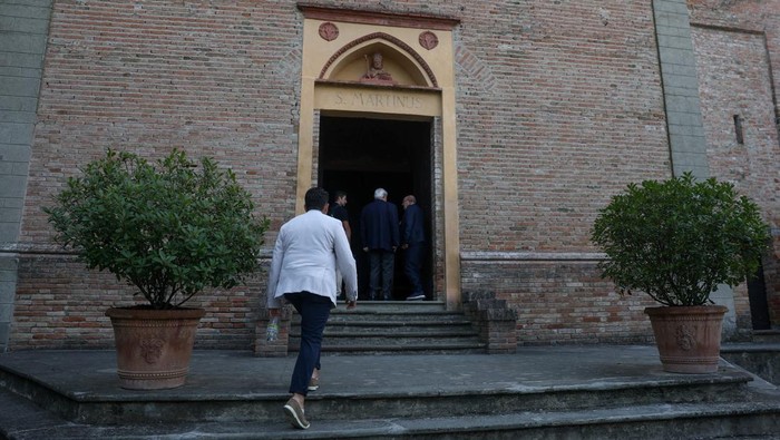 A man walks outside San Martino church, where a private funeral ceremony for Italian fashion designer Giorgio Armani is to be held, in Rivalta, Italy September 8, 2025. REUTERS/Gonzalo Fuentes