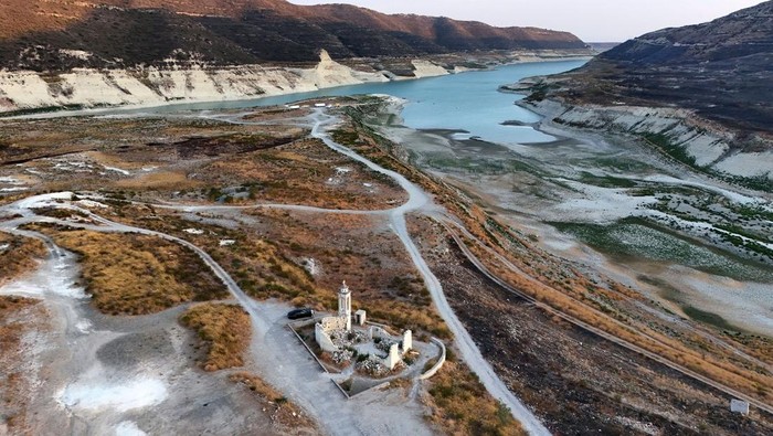 An aerial view of Kouris reservoir, where a once-submerged Church is fully exposed, near Alassa village in Limassol, Cyprus August 26, 2025. REUTERS/Yiannis Kourtoglou