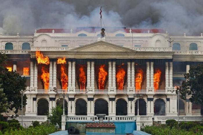 Fire rages through the Singha Durbar, the main administrative building for the Nepal government, in Kathmandu on September 9, 2025, a day after a police crackdown on demonstrations over social media prohibitions and corruption by the government. Nepali youth protesters set fire to parliament on September 9 as the veteran prime minister obeyed furious crowds to quit, a day after one of the deadliest crackdowns in years in which at least 19 people were killed. (Photo by Prabin RANABHAT / AFP) / The erroneous mention[s] appearing in the metadata of this photo by Anup OJHA has been modified in AFP systems in the following manner: [Byline - Prabin RANABHAT] instead of [Byline - Anup OJHA]. Please immediately remove the erroneous mention[s] from all your online services and delete it (them) from your servers. If you have been authorized by AFP to distribute it (them) to third parties, please ensure that the same actions are carried out by them. Failure to promptly comply with these instructions will entail liability on your part for any continued or post notification usage. Therefore we thank you very much for all your attention and prompt action. We are sorry for the inconvenience this notification may cause and remain at your disposal for any further information you may require.