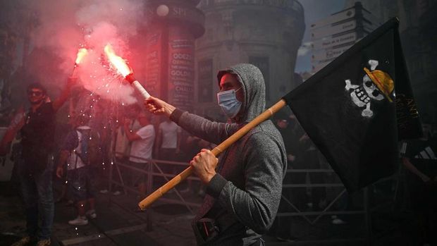 A protester waving a pirate flag during a demonstration in Montpellier, France, on Sept 10.PHOTO: AFP