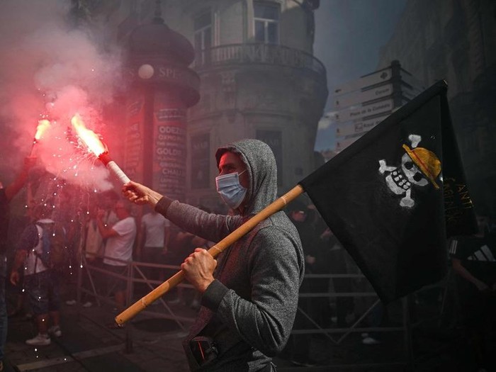 A protester waving a pirate flag during a demonstration in Montpellier, France, on Sept 10.

PHOTO: AFP