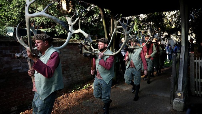 Dancers carrying sets of antlers perform the Horn Dance, which dates back to 1226 in the village of Abbots Bromley, Britain, September 8, 2025. REUTERS/Phil Noble