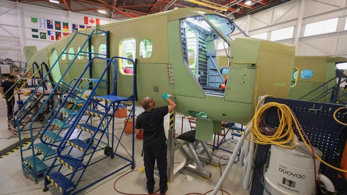 A technician works in one of the facilities of De Havilland Canada, as the company produces the Canadair 515 water-bomber to combat wildfires, in Calgary, Alberta, Canada, August 22, 2025. REUTERS/Ahmed Zakot