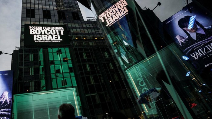 A billboard in Times Square displays the message 