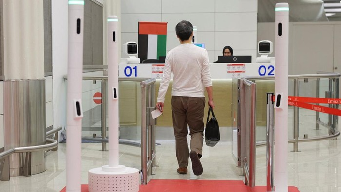 A passenger walks through the red carpet corridor, a newly unveiled smart tunnel, at Dubai International Airport, in Dubai, United Arab Emirates, September 16, 2025. REUTERS/Amr Alfiky