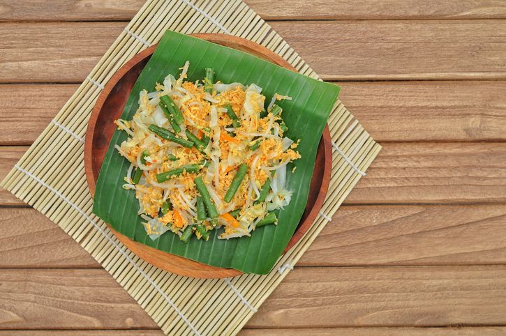 Urap (Indonesia Traditional Food). Urap is a salad dish of steamed vegetables mixed with seasoned and spiced grated coconut for dressing.