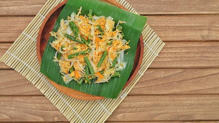 Urap (Indonesia Traditional Food). Urap is a salad dish of steamed vegetables mixed with seasoned and spiced grated coconut for dressing.