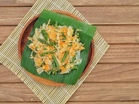 Urap (Indonesia Traditional Food). Urap is a salad dish of steamed vegetables mixed with seasoned and spiced grated coconut for dressing.