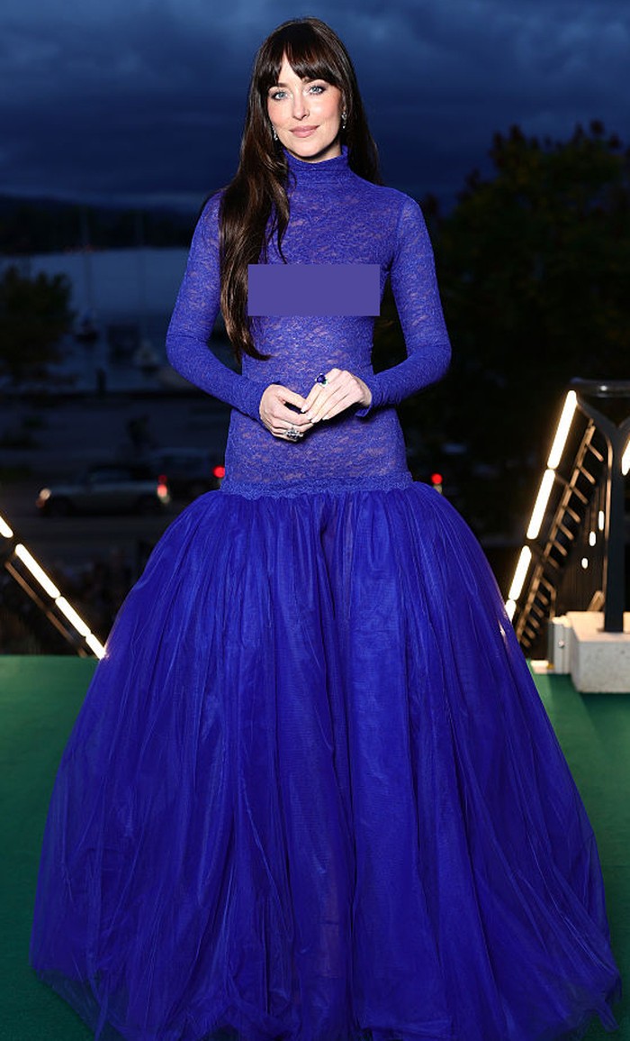 ZURICH, SWITZERLAND - SEPTEMBER 25: (EDITORS NOTE: Image contains nudity.) Dakota Johnson accepts the Golden Eye Award during the 