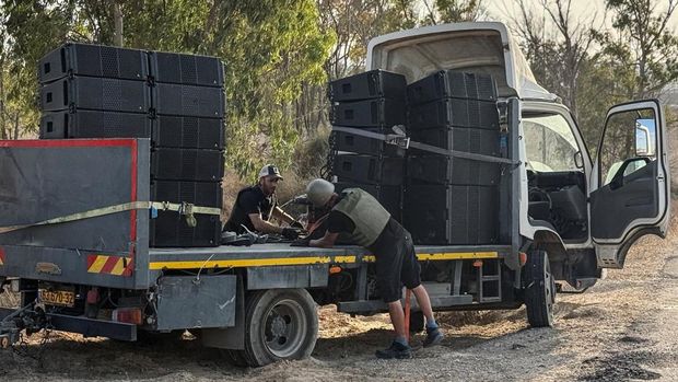 Loudspeakers mounted on trucks are seen near the Israel-Gaza border on the Israeli side on 26 September. Photograph: Rami Amichay/Reuters