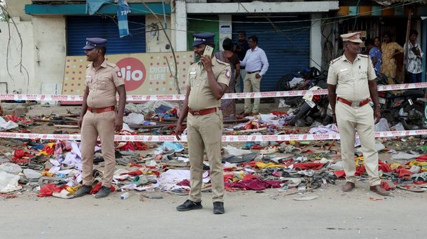 Police officers stand guard at the site following a stampede incident during a election campaign rally held by Tamilaga Vettri Kazhagam party, in Karur district of Tamil Nadu, India, September 28, 2025. REUTERS/Priyanshu Singh