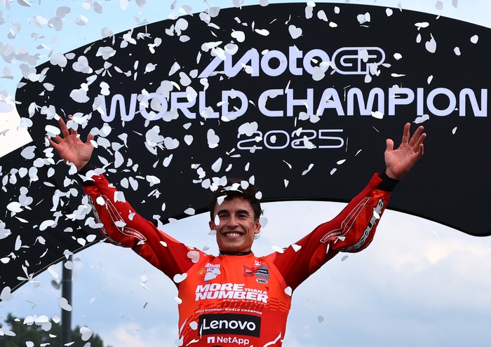 MotoGP - Japanese Grand Prix - Mobility Resort Motegi, Motegi, Japan - September 28, 2025 Ducati Lenovo Teams Marc Marquez celebrates on the podium after winning the 2025 MotoGP World Championship REUTERS/Kim Kyung-Hoon