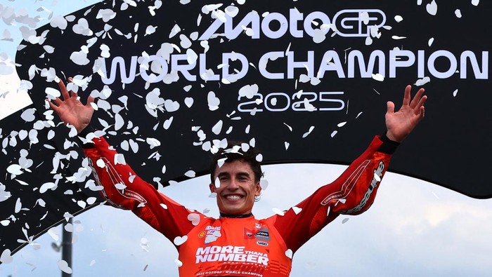 MotoGP - Japanese Grand Prix - Mobility Resort Motegi, Motegi, Japan - September 28, 2025 Ducati Lenovo Teams Marc Marquez celebrates on the podium after winning the 2025 MotoGP World Championship REUTERS/Kim Kyung-Hoon
