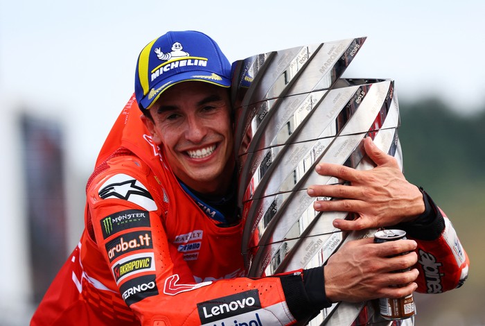 MotoGP - Japanese Grand Prix - Mobility Resort Motegi, Motegi, Japan - September 28, 2025 Ducati Lenovo Teams Marc Marquez celebrates on the podium with the trophy after winning the 2025 MotoGP World Championship REUTERS/Kim Kyung-Hoon