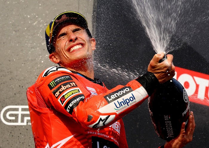 MotoGP - Japanese Grand Prix - Mobility Resort Motegi, Motegi, Japan - September 28, 2025 Ducati Lenovo Teams Marc Marquez celebrates with champagne on the podium after finishing second place in the race and winning the 2025 MotoGP World Championship REUTERS/Kim Kyung-Hoon