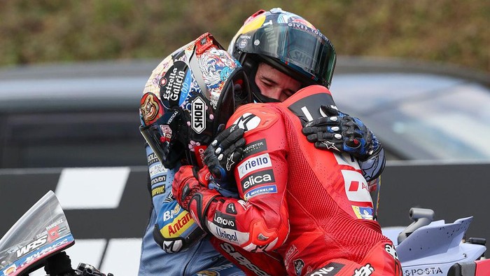 MOTEGI, JAPAN - SEPTEMBER 28: Alex Marquez of Spain riding the BK8 Gresini Racing Ducati (73) congratulates Marc Marquez of Spain riding the Lenovo Ducati (93) on winning the World Championship during the MotoGP of Japan race at Twin Ring Motegi on S