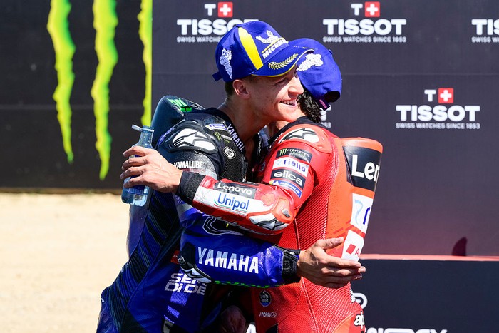 BARCELONA, SPAIN - SEPTEMBER 06: Fabio Quartararo of France riding the Monster Energy Yamaha (20) and Marc Marquez of Spain riding the Lenovo Ducati (93) chat with each other during the Sprint ahead of the MotoGP of Catalunya at Circuit de Barcelona-Catalunya on September 06, 2025 in Barcelona, Spain. (Photo by Gold & Goose Photography/Getty Images)