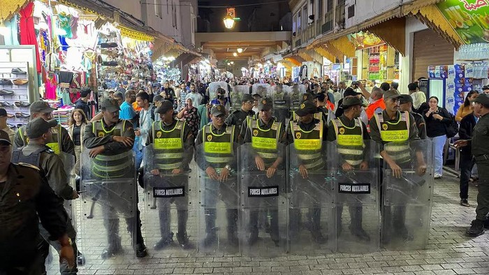 Members of the security forces stand guard as they prevent a protest demanding reforms in education and health from taking place, in Rabat, Morocco, September 29, 2025. REUTERS/Ahmed El Jechtimi Purchase Licensing Rights