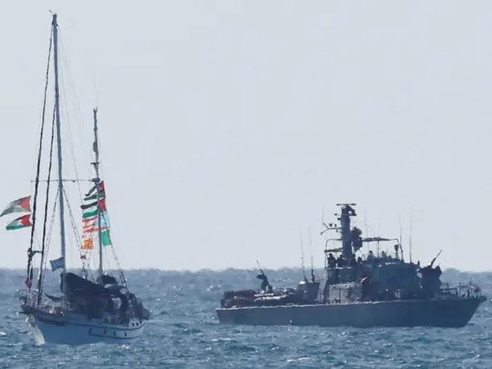 An Israeli navy vessel escorts a vessel from the Global Sumud Flotilla to Ashdod Port, in southern Israel, October 2, 2025. (Reuters)