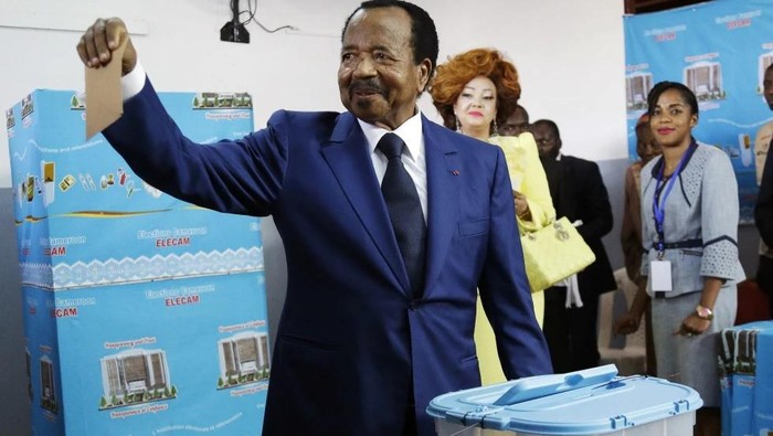 Cameroon’s incumbent President Paul Biya, of the Cameroon People’s Democratic Movement party, casts his vote during the presidential elections in Yaounde, Cameroon, Sunday Oct. 7, 2018. (AP Photo/Sunday Alamba, File)