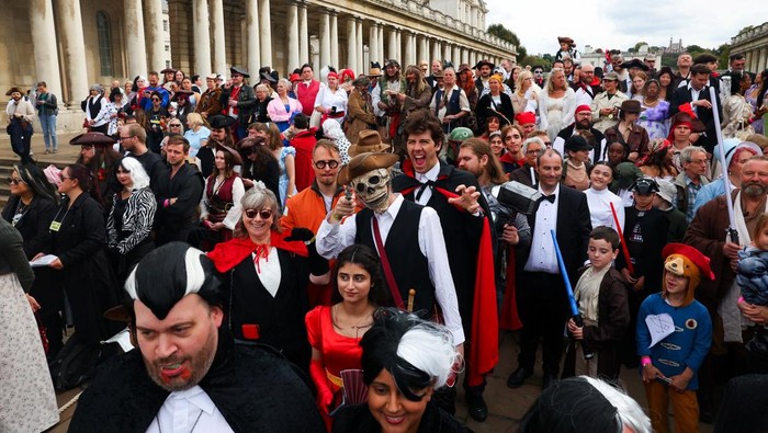 Cosplayers pose for a group photo after breaking the Guinness World Record for the largest gathering of people dressed as screen characters, at the Old Royal Naval College in London, Britain, September 27, 2025. REUTERS/Isabel Infantes