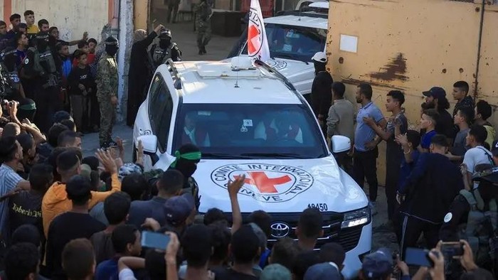 Red Cross vehicles transport hostages, held in Gaza since the deadly October 7, 2023 attack, following their handover as part of a ceasefire and hostages-prisoners swap deal between Hamas and Israel, in Gaza City October 13, 2025. (Reuters)