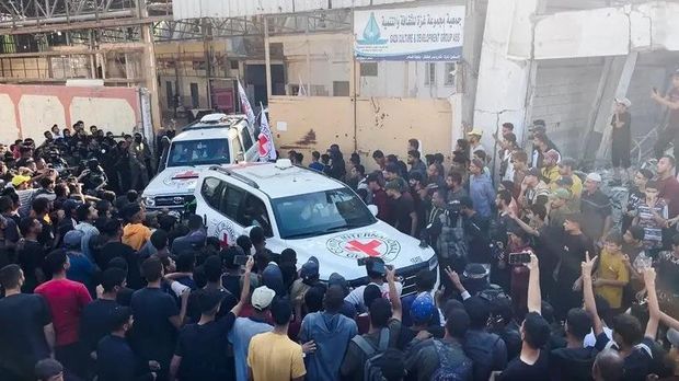 A Red Cross vehicle transports hostages, held in Gaza since the deadly October 7, 2023 attack, following their handover as part of a ceasefire and hostages-prisoners swap deal between Hamas and Israel, in Gaza City October 13, 2025 in this still image taken from video. (Reuters)