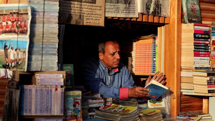 People visit the Al-Azbakeya book market, one of Cairo's oldest cultural hubs for over a century, which has been renovated, in Cairo, Egypt, September 29, 2025. REUTERS/Mohamed Abd El Ghany