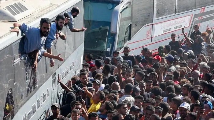 People gather at Nasser hospital as they welcome freed Palestinian prisoners released by Israel as part of a hostages-prisoners swap and a ceasefire deal between Hamas and Israel, in Khan Younis in the southern Gaza Strip, October 13, 2025. (Reuters)