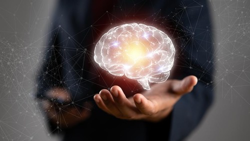 Businessman holding human brain and icon customer digital network with effective business mindset on paper texture background