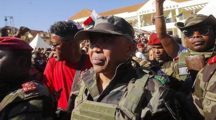 Colonel Michael Randrianirina arrives with members of the military to join protesters gathered outside the town hall on Independence Avenue during a nationwide youth-led demonstration against frequent power outages and water shortages, in Antananarivo, Madagascar, October 14, 2025. REUTERS/Zo Andrianjafy Purchase Licensing Rights