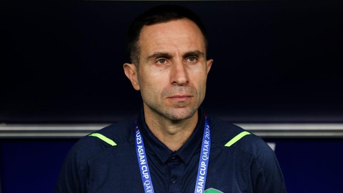AL WAKRAH, QATAR - APRIL 20: Kapadze Timur coach of Uzbekistan looks on during the AFC U23 Asian Cup Group D match between Kuwait and Uzbekistan at Al Janoub Stadium on April 20, 2024 in Al Wakrah, Qatar.  (Photo by Zhizhao Wu/Getty Images)