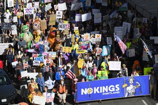 PORTLAND, OREGON - OCTOBER 18: Demonstrators march through downtown Portland during the 