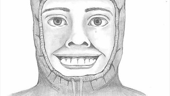 Tersangka digambarkan sebagai pria kulit hitam berusia awal 20-an, tinggi sekitar 180 cm, bertubuh ramping, gigi kuning yang tersusun rapi, gusi gelap, dan tahi lalat hitam di bawah matanya. Ia mengenakan sweter berkerudung merah dengan simbol swoosh Nike hitam. Tudungnya ia kenakan hingga menutupi sebagian wajahnya. Ia juga mengenakan celana pendek hitam dan kaus kaki panjang hitam. Foto: Boredpanda