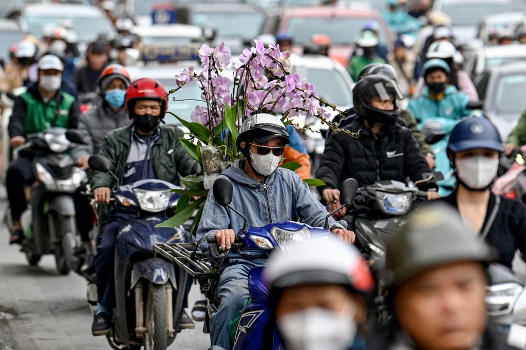 Pengendara motor di Vietnam. (Nhac NGUYEN / AFP)