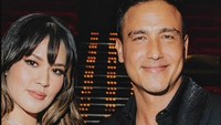 Visual Raisa memakai gaun merah dan Hamish Daud memakai kemeja dan jas hitam. Foto: Instagram @hamishdw