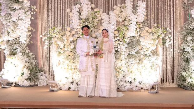 Pernikahan anak bungsu Erick Thohir, Magisha Afryea Thohir, dengan Moshe Darron Panjaitan pada Sabtu, (18/10/2025). Pernikahan anak bungsu Erick Thohir, Magisha Afryea Thohir, dengan Moshe Darron Panjaitan pada Sabtu, (18/10/2025). (Instagram/taufikhidayatofficial)